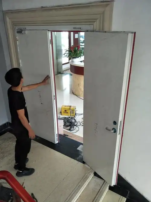 Are intumescent seals required on fire doors, and how much do they expand under fire conditions?